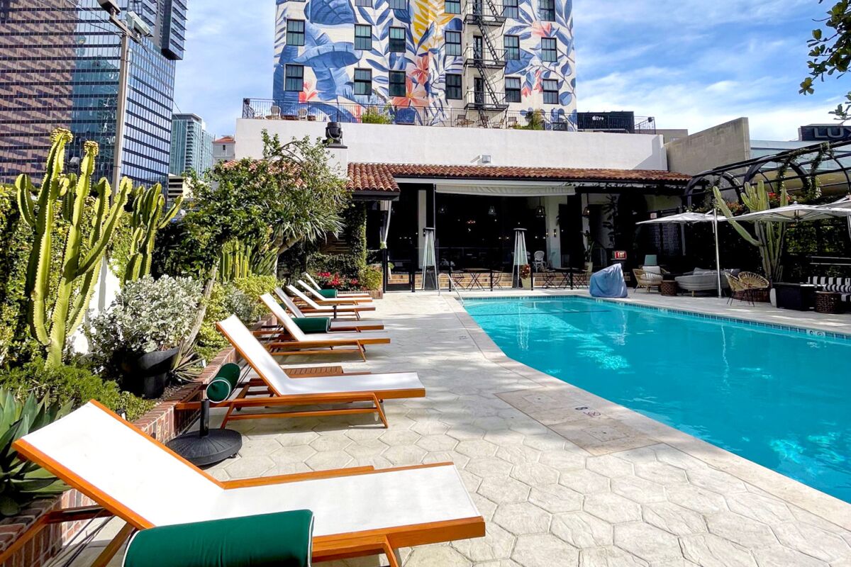 The wall-sized mural distinguishes the Hotel Figueroa's pool area.