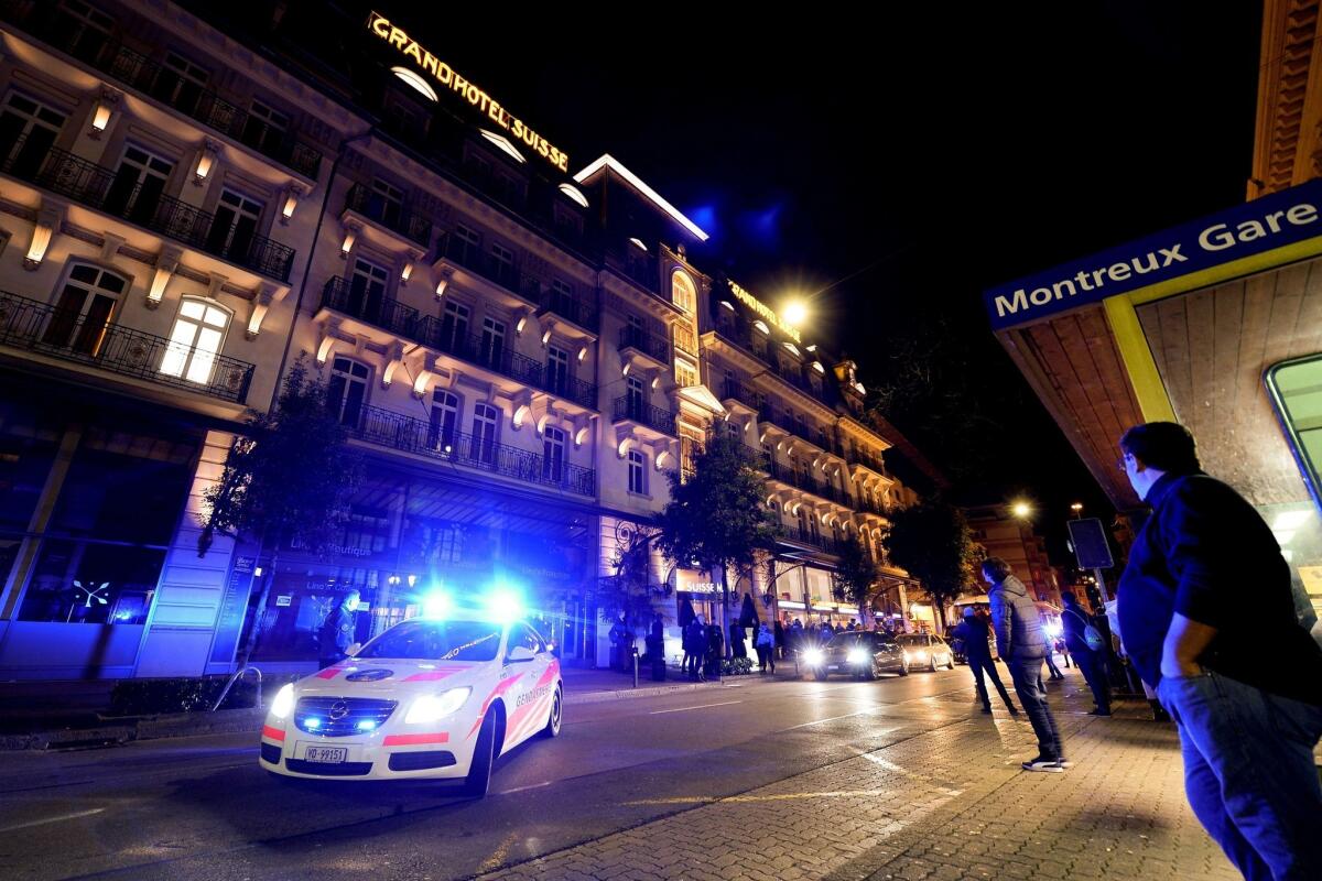 Police block the street for the arrival of Syrian government officials at their hotel in Montreux, Switzerland, on the eve of the so-called Geneva II peace talks.