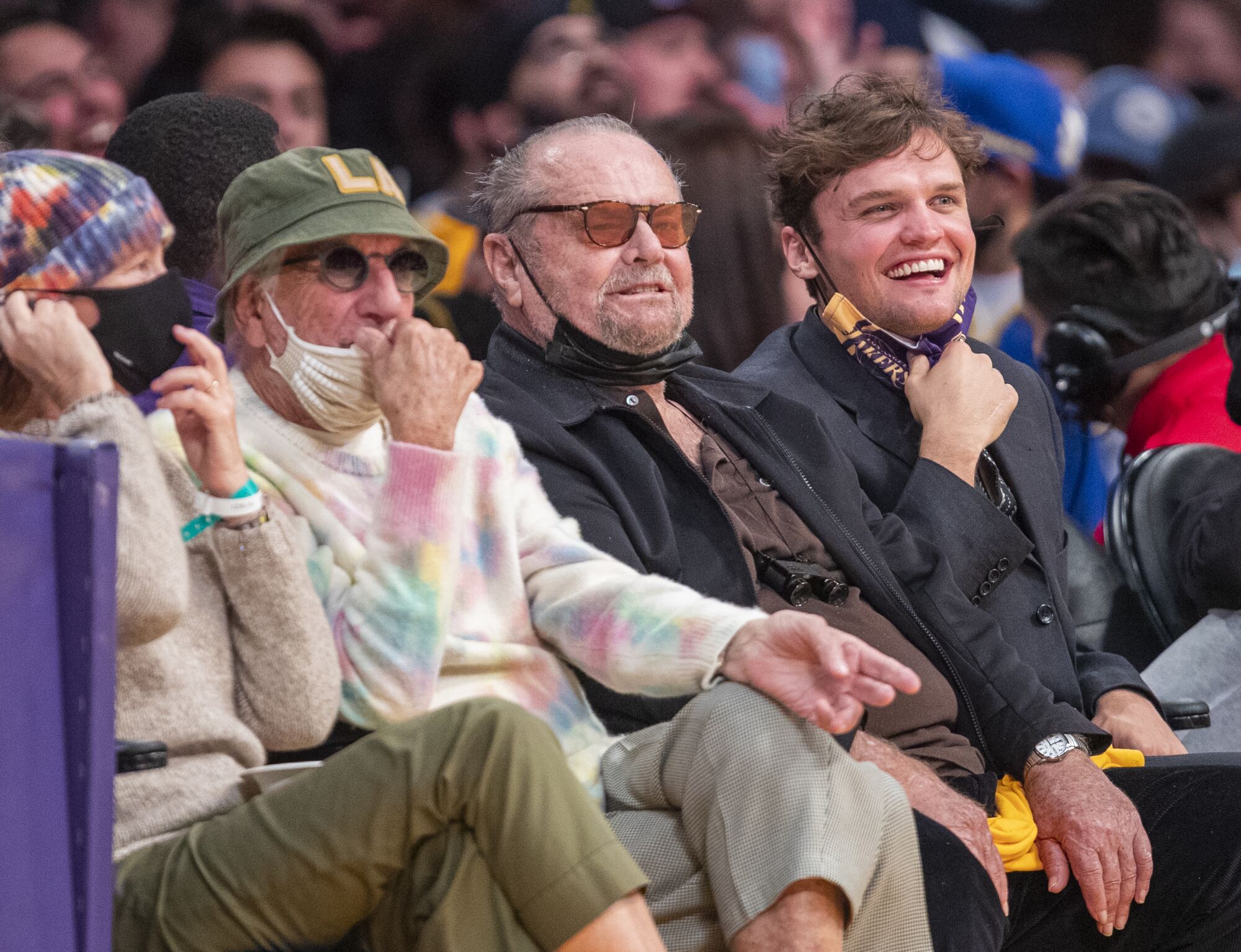Jack Nicholson watches the game with his son Ray.