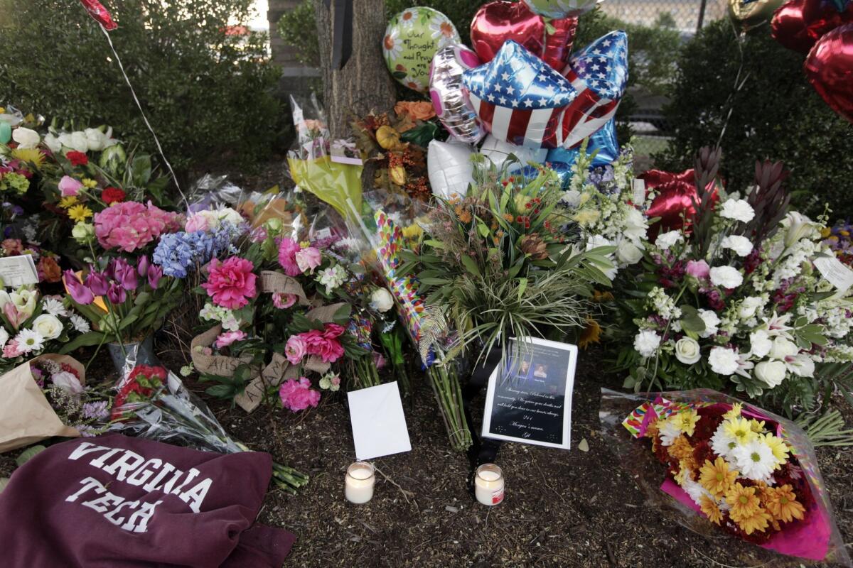 Flowers are left for the two journalists that were killed on Aug 26 during a live broadcast in Roanoke, Va.