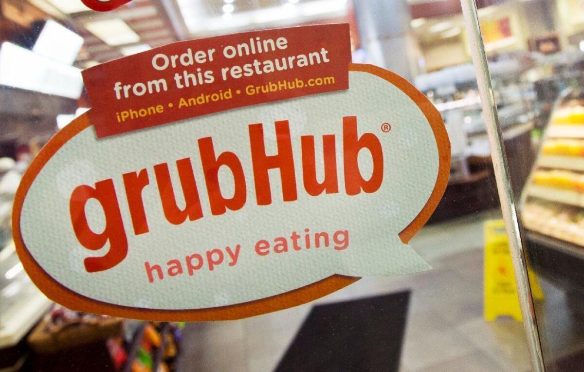 A Grubhub sign hangs in a grocery store. 