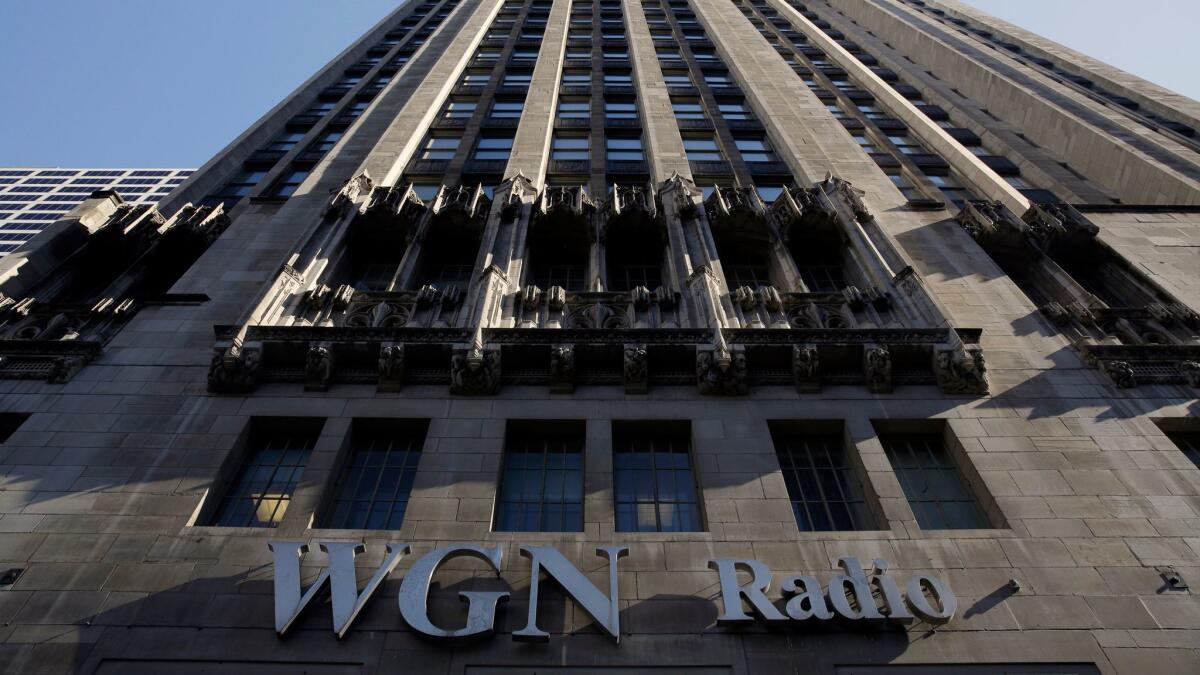 The WGN Radio sign appears on the side of Tribune Tower in Chicago.