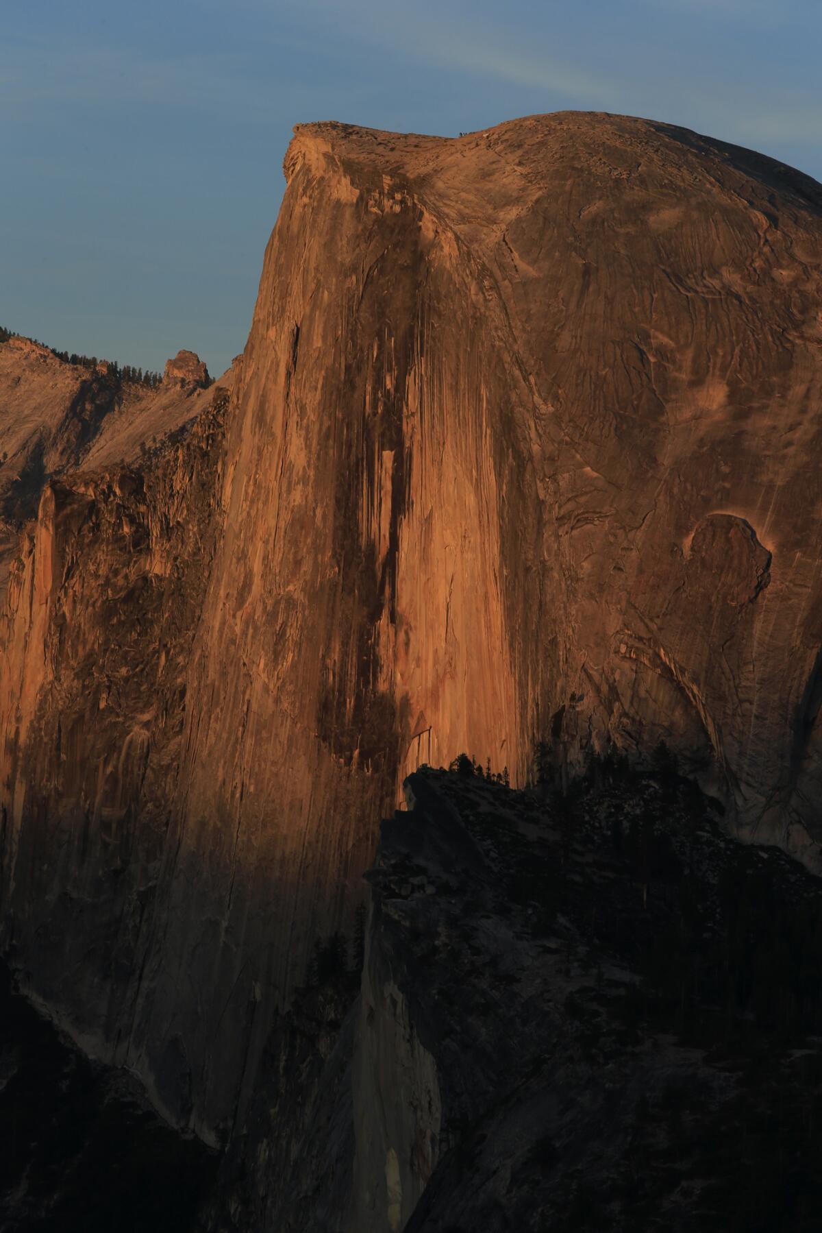 Half Dome glows in the setting sun in this view from Glacier Point in Yosemite National Park.