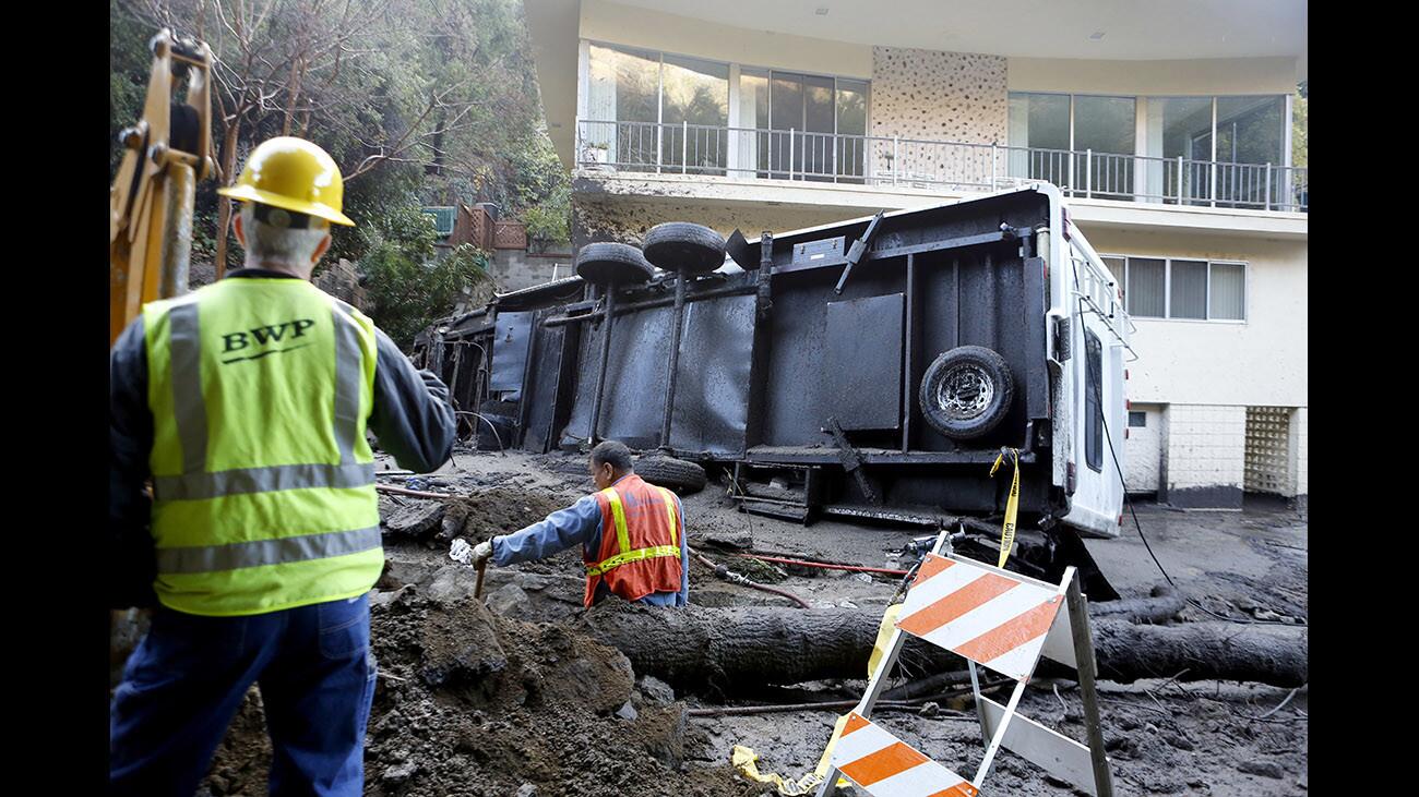 Photo Gallery: Mudslide clean up on Country Club Drive