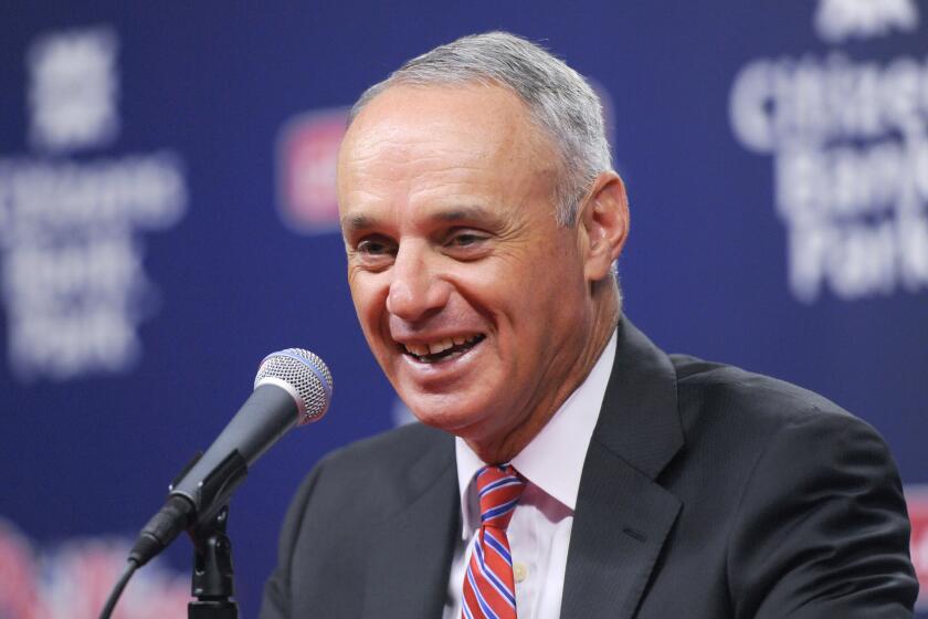 Baseball Commissioner Rob Manfred talks to members of the media during a news conference Aug. 27.
