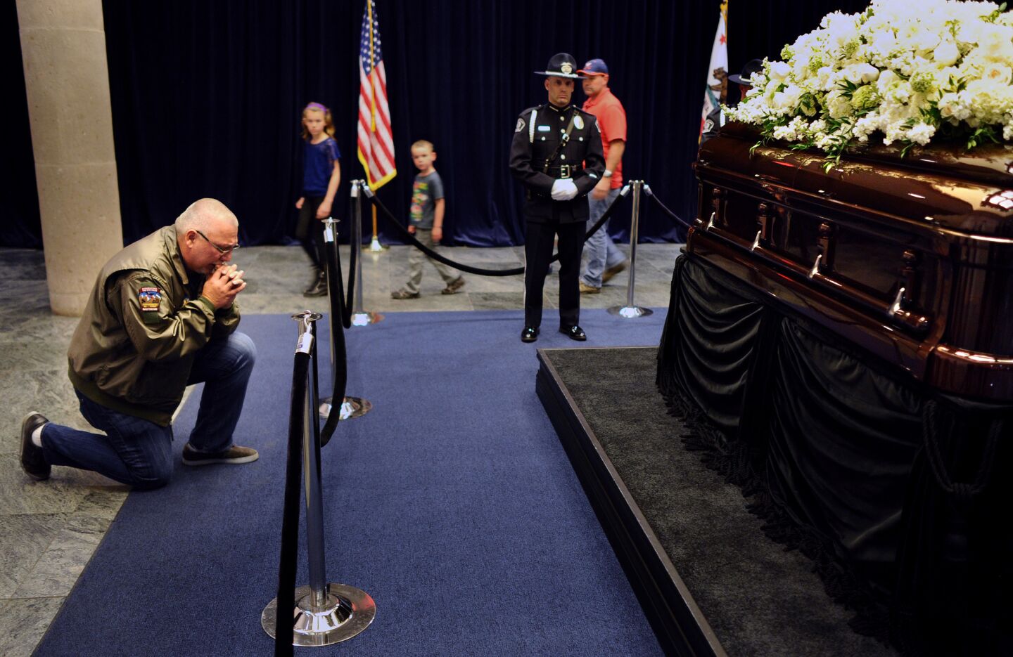 Steven Leslie prays in front of the casket of Nancy Reagan at the Reagan Presidential Library in Simi Valley.