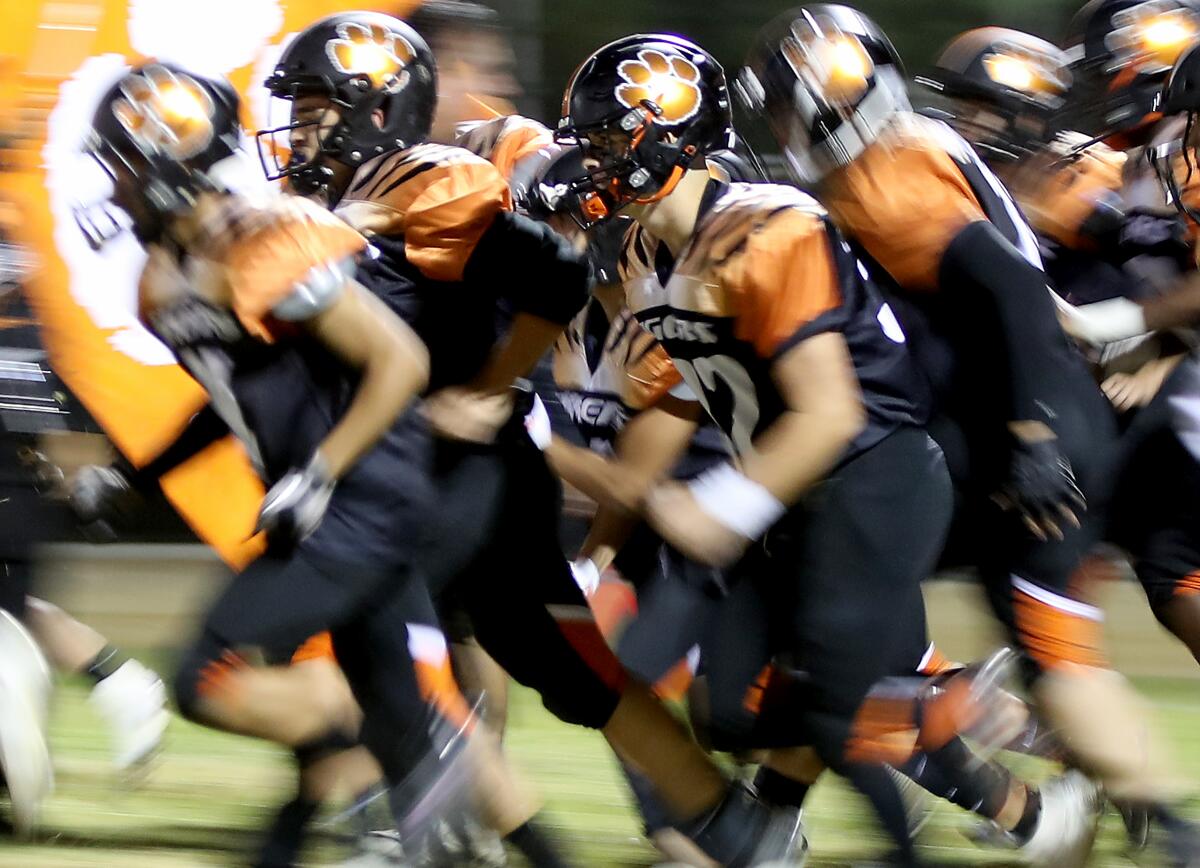 The Lincoln High Tigers take the field for a home game against Franklin.