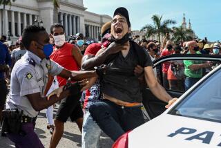 A man is arrested during a demonstration against the government of Cuban President Miguel Diaz-Canel in Havana