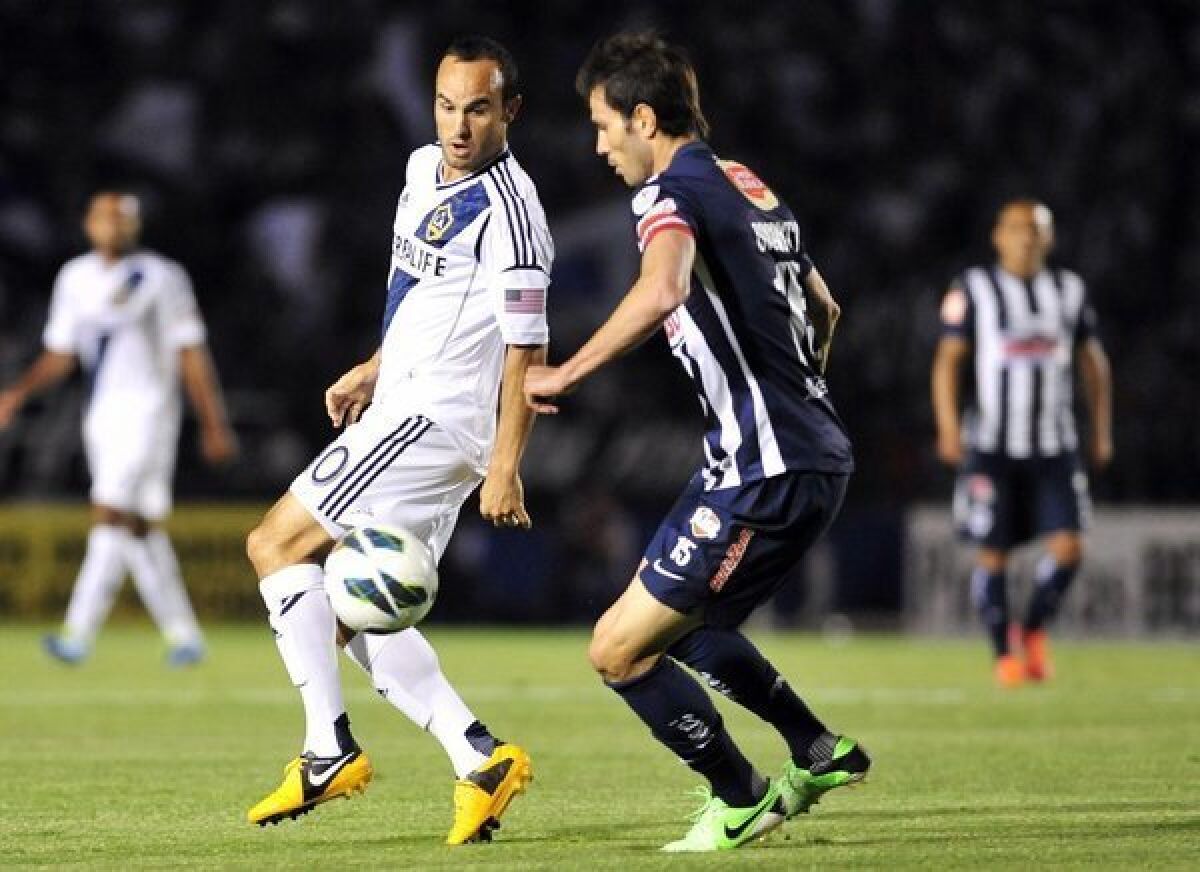 Landon Donovan vies for the ball with Monterrey's Jose Basanta during a Champions League game on Wednesday.