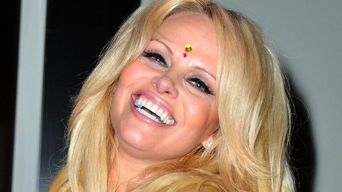Pamela Anderson says a treatment she started in August has cured her of hepatitis C.
