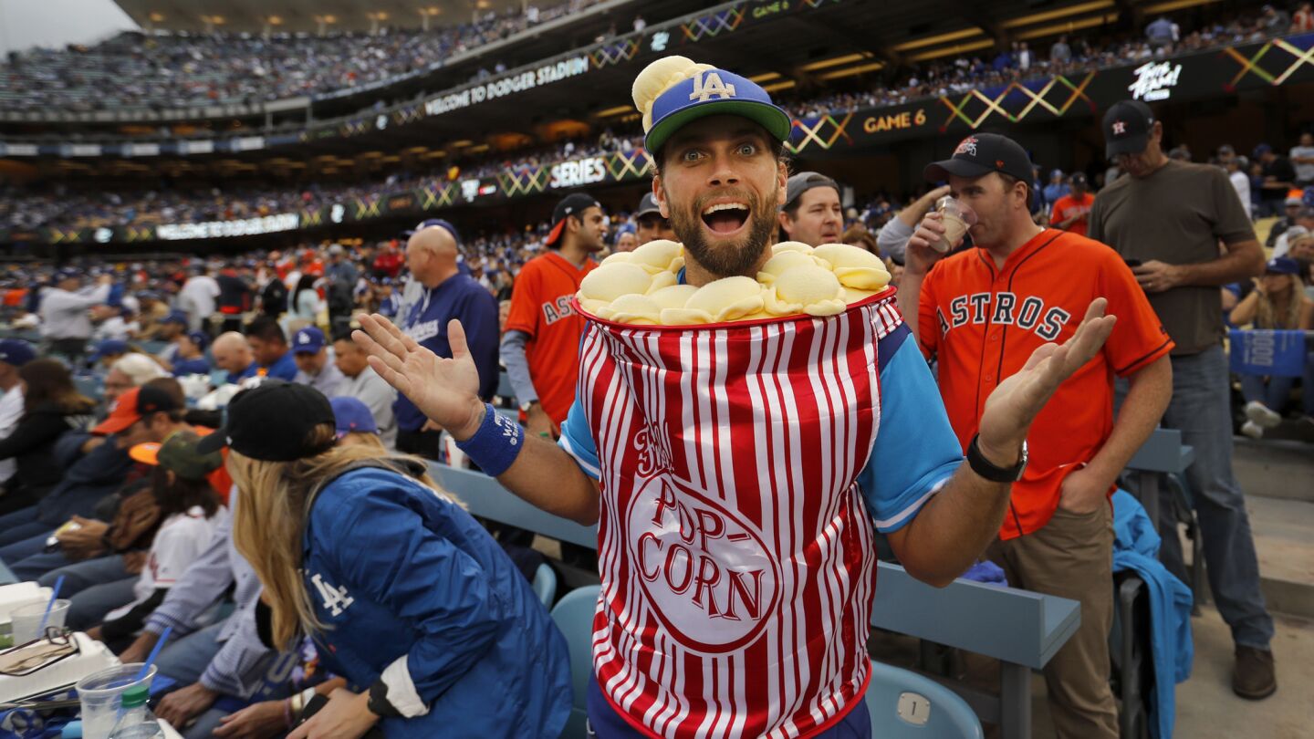 Jarratt Rouse, of Santa Barbara, sports his popcorn Halloween costume before the start of Game 6.