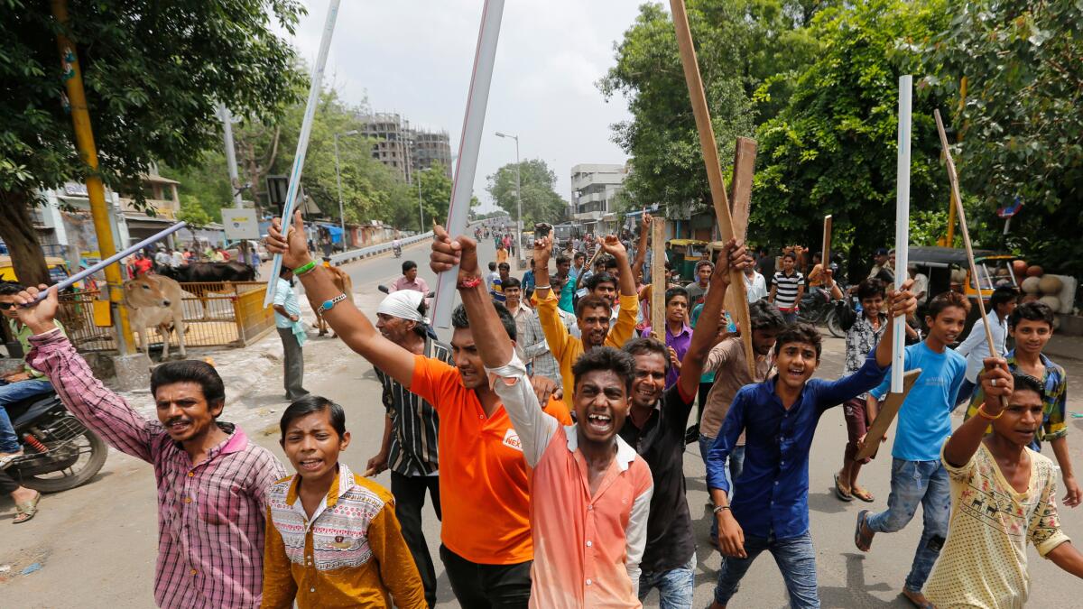 Members of India's low-caste Dalit community protest Wednesday the recent beating of four Dalit men who were attacked while trying to skin a dead cow last week in Gujarat state.