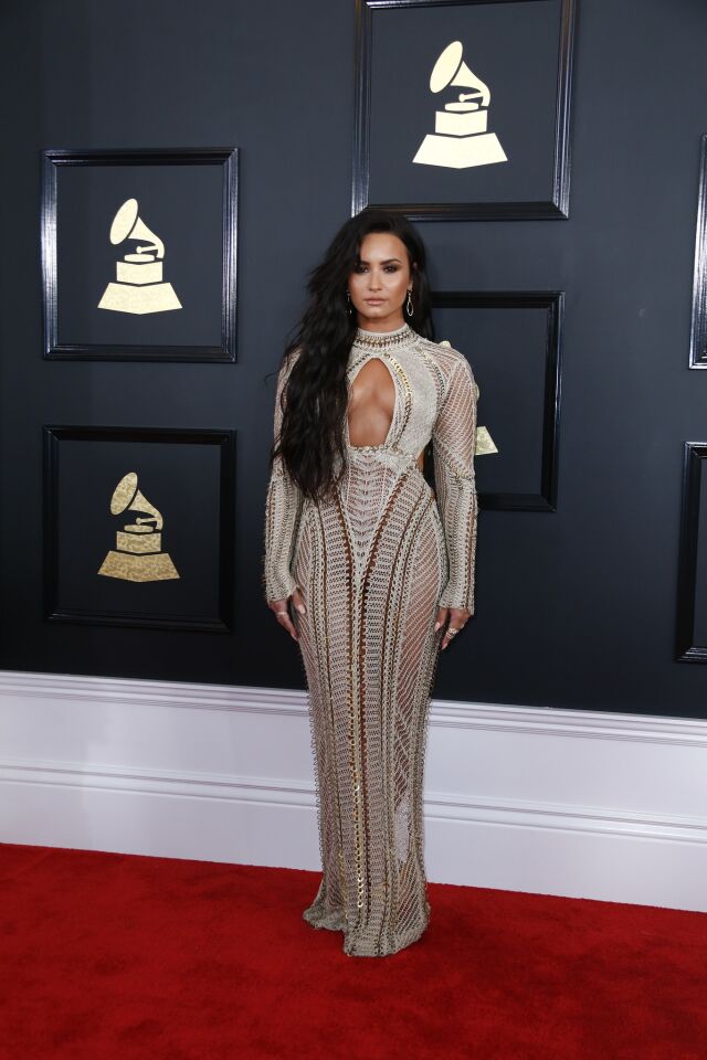 Demi Lovato arrives at the 59th Grammy Awards.