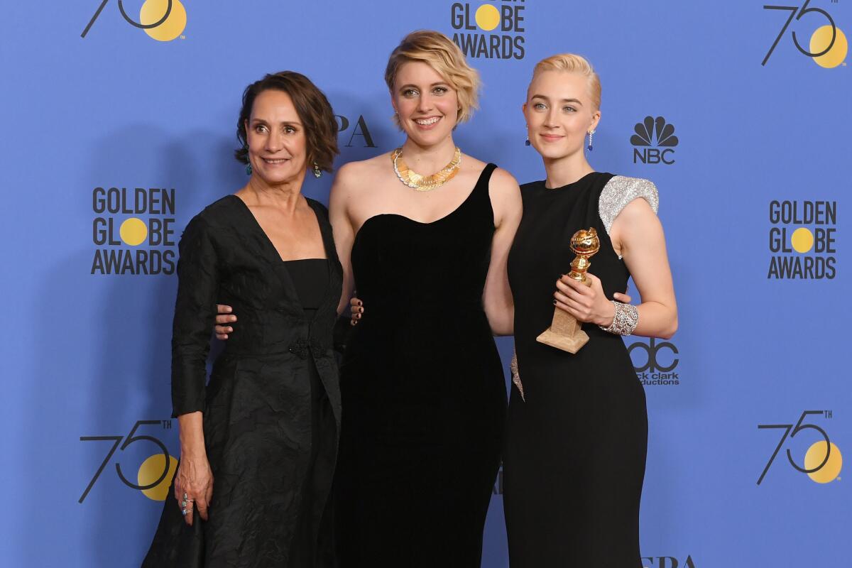 "Lady Bird" writer-director Greta Gerwig, center, with her stars Laurie Metcalf, left, and Saoirse Ronan in the Golden Globes press room.