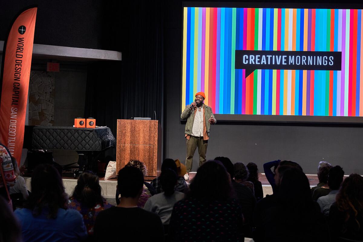 CreativeMornings/SanDiego Host Ramel Wallace welcomes a full house at the San Diego Central Library on Sept. 29, 2023.