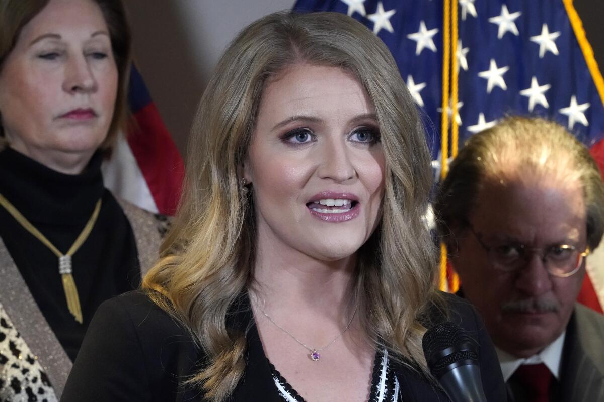 FILE - Jenna Ellis, a member of then-President Donald Trump's legal team, speaks during a news conference at the Republican National Committee headquarters, Nov. 19, 2020, in Washington. A judge in Colorado on Tuesday, Aug. 16, 2022, ordered Ellis to travel to Georgia to testify before a special grand jury that's looking into whether Trump and others illegally tried to influence the 2020 election in Georgia. (AP Photo/Jacquelyn Martin, File)