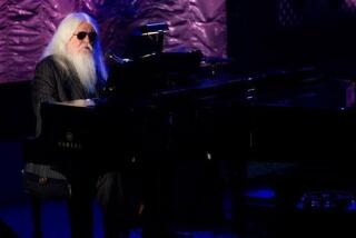 Inductee Leon Russell performs onstage at the 42nd Annual Songwriters Hall of Fame Awards in New York, Thursday, June 16, 2011. (AP Photo/Charles Sykes)