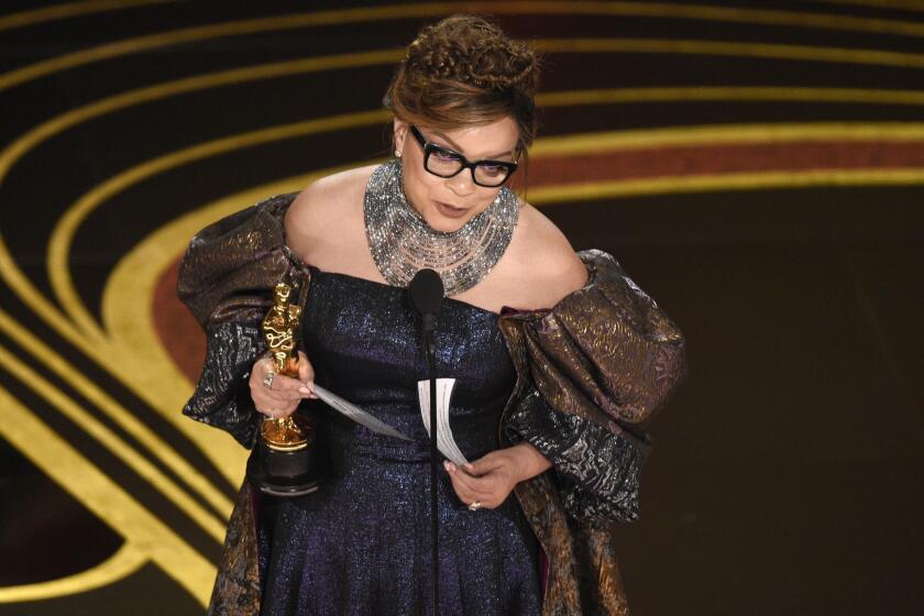 Ruth E. Carter accepts the award for best costume design for "Black Panther" at the Oscars on Sunday, Feb. 24, 2019, at the Dolby Theatre in Los Angeles. (Photo by Chris Pizzello/Invision/AP)