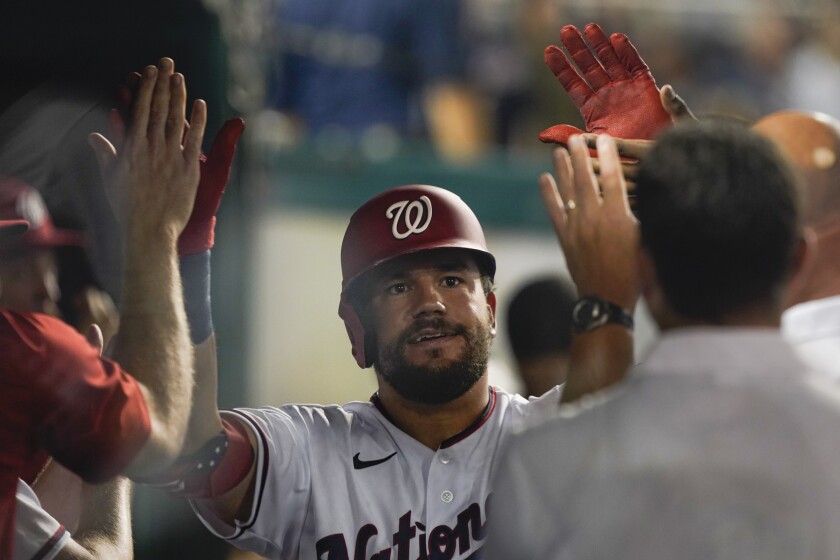 Washington Nationals' Kyle Schwarber celebrates his go-ahead home run in the seventh inning of a baseball game against the Pittsburgh Pirates, Monday, June 14, 2021, in Washington. (AP Photo/Carolyn Kaster)