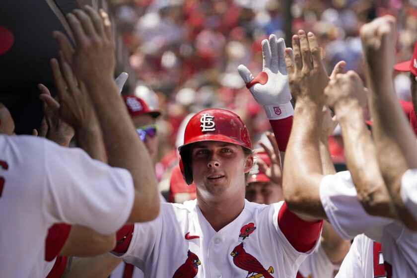 St. Louis Cardinals' Nolan Gorman is congratulated by teammates after hitting a two-run home run during the third inning of a baseball game against the San Diego Padres Monday, May 30, 2022, in St. Louis. (AP Photo/Jeff Roberson)