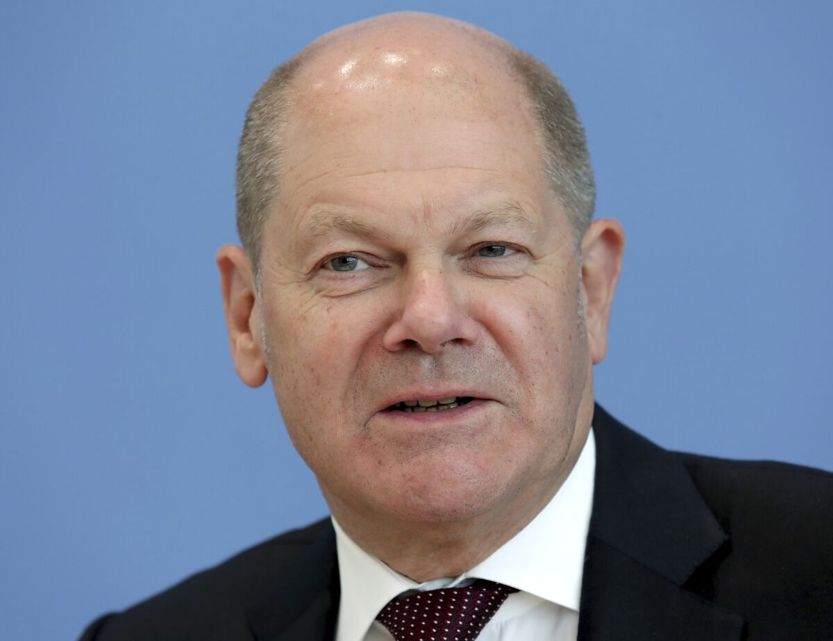 File---File picture taken May 14, 2020 shows German Finance Minister Olaf Scholz addressing the media during a press conference in Berlin, Germany. (AP Photo/Michael Sohn, file)