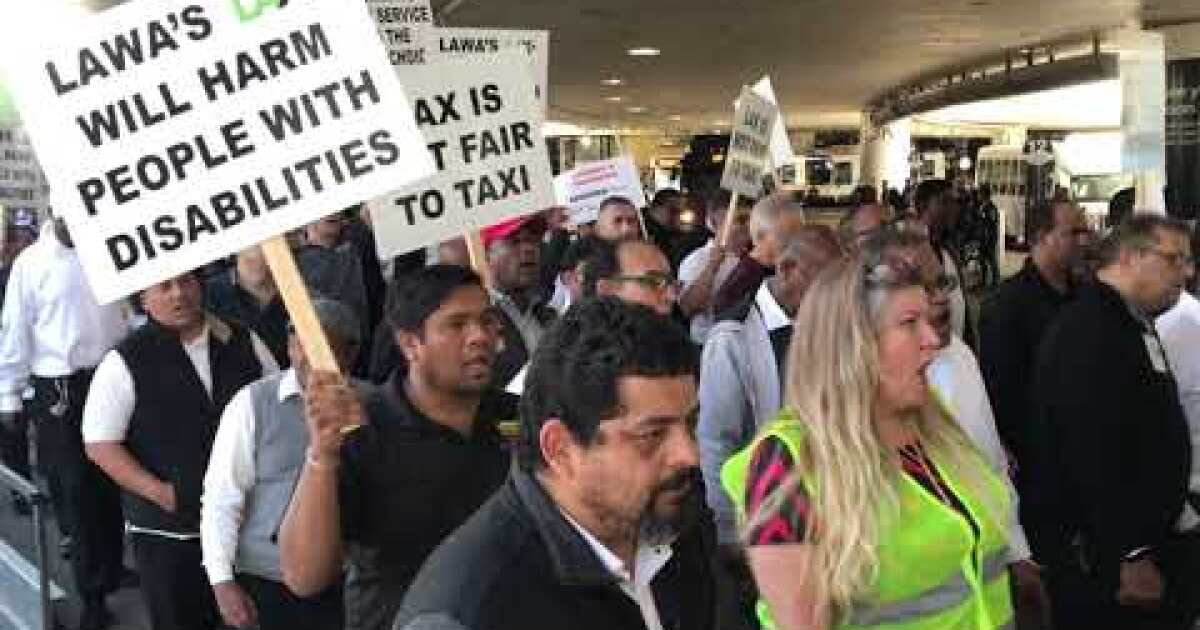 Taxi drivers picket at LAX, asking city officials to reinstate curbside pickups