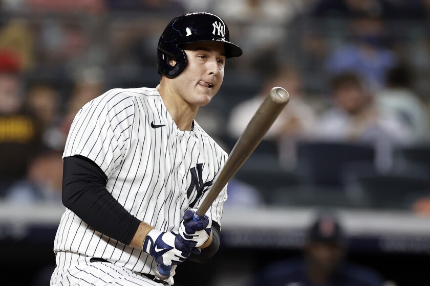 FILE - New York Yankees' Anthony Rizzo watches his two-run single during the second inning of the team's baseball game against the Boston Red Sox on Aug. 18, 2021, in New York. Rizzo is staying with the Yankees, agreeing Tuesday night, March 15, to a $32 million, two-year contract, a person familiar with the negotiations told The Associated Press. The person spoke on condition of anonymity because the agreement was subject to a successful physical. (AP Photo/Adam Hunger, File)
