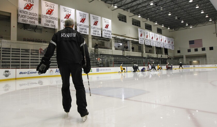 Kings Coach Darryl Sutter takes the ice to begin practice.