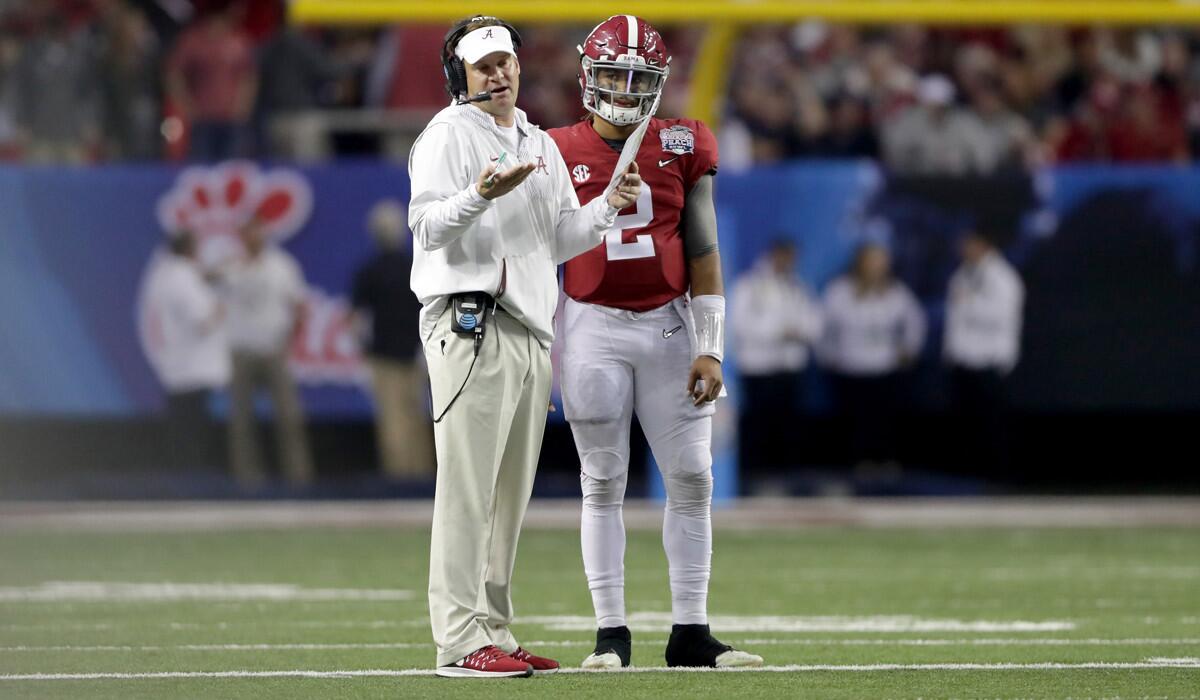 Lane Kiffin talks turnover to Alabama quarterback Jalen Hurts (2) during the 2016 Chick-fil-A Peach Bowl on Dec. 31, 2016.