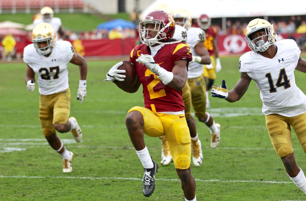 USC's Adoree' Jackson runs away from Notre Dame defenders on a 52-yard touchdown reception on Nov. 26.
