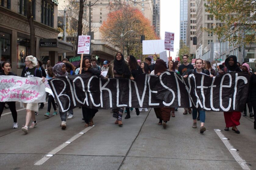 Protesters carry a "Black Lives Matter" banner as they march through downtown Seattle in November.