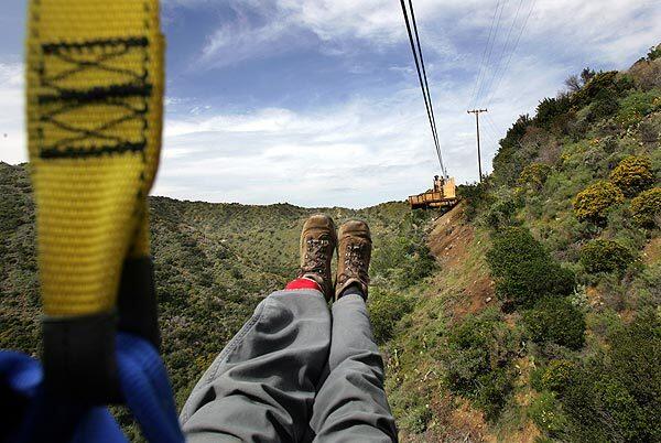 As part of its effort to enhance Santa Catalina Island as a tourist destination, the Santa Catalina Island Co. has created a 3,671-foot-long zipline ride. After designer Bradd Morse inspected and tested the line, Times photographer Bob Chamberlin tried out the first leg of the attraction. The company hopes to open the zipline to the public April 14.