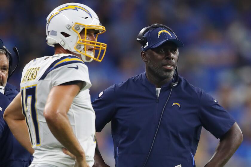 DETROIT, MICHIGAN - SEPTEMBER 15: Head coach Anthony Lynn of the Los Angeles Chargers talks with Philip Rivers #17 during the second quarter while playing the Detroit Lions at Ford Field on September 15, 2019 in Detroit, Michigan. (Photo by Gregory Shamus/Getty Images)