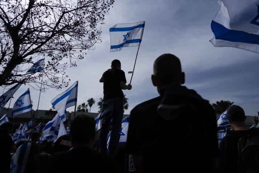 Israeli military reservists protest against plans by Prime Minister Benjamin Netanyahu's government to overhaul the judicial system, in Tel Aviv, Israel, Wednesday, March 22, 2023. (AP Photo/Oded Balilty)