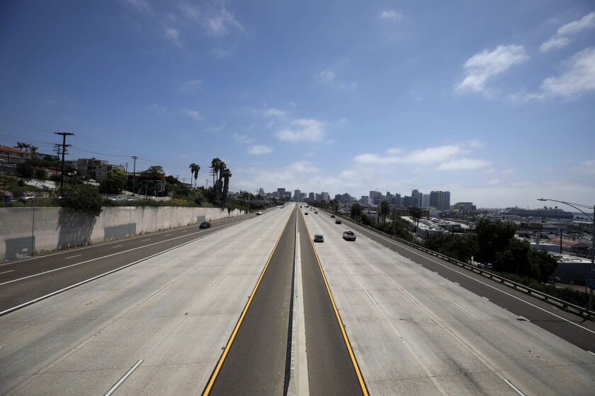 I-5 headed into and away from downtown San Diego is light on April 28, 2020. During the coronavirus pandemic, vehicle traffic has been greatly reduced.