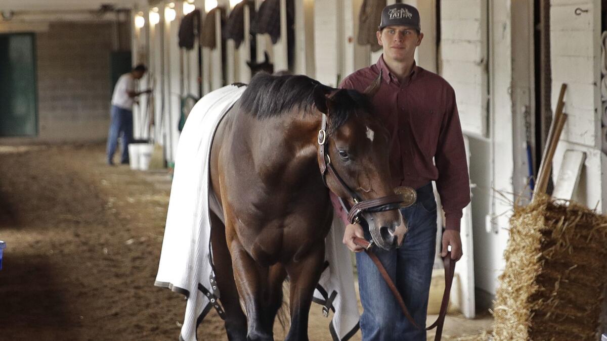 Kentucky Derby favorite Omaha Beach is walked in his barn after a workout at Churchill Downs on April 30.