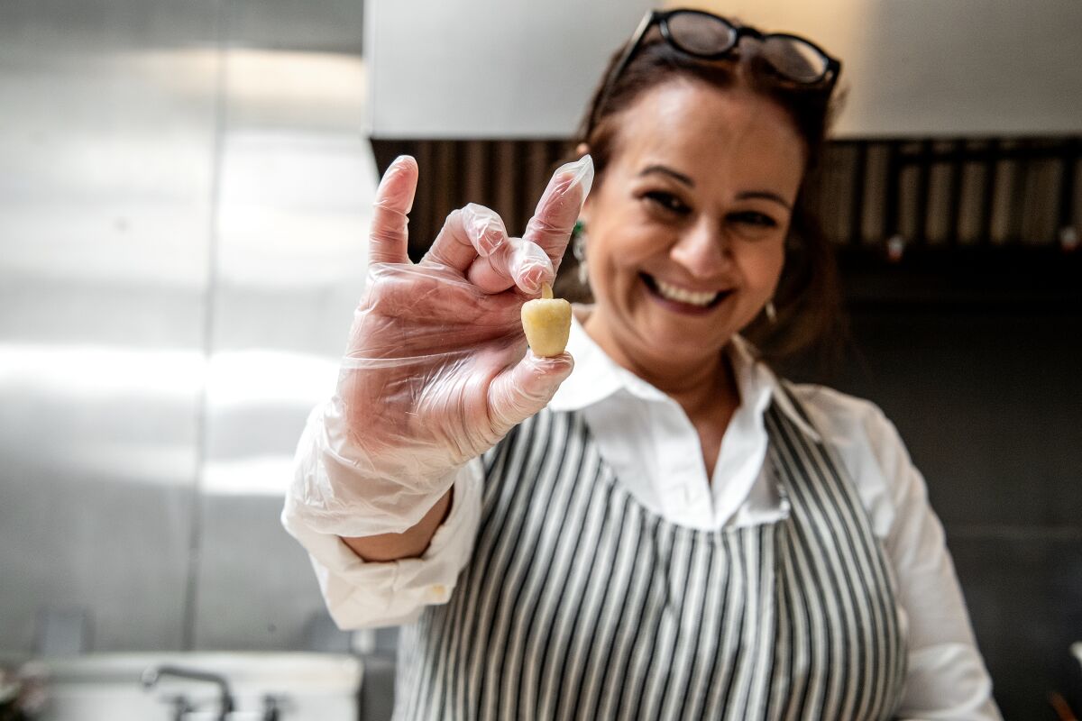 Fariba Nafissi demonstrates making toot, a candy frequently served during Nowruz celebrations.