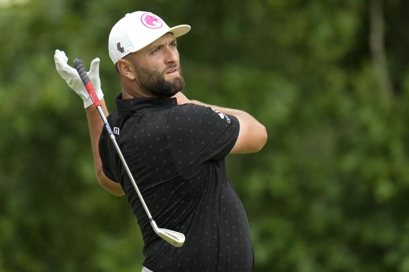 Jon Rahm, of Spain, reacts to his tee shot on the 11th hole during the first round of the PGA Championship golf tournament at the Valhalla Golf Club, Thursday, May 16, 2024, in Louisville, Ky. (AP Photo/Jeff Roberson)