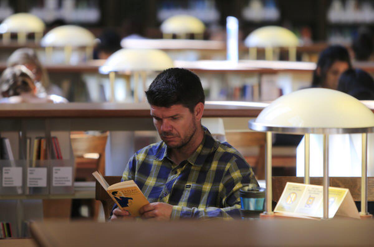 Steven Czifra studies in a UC Berkeley library