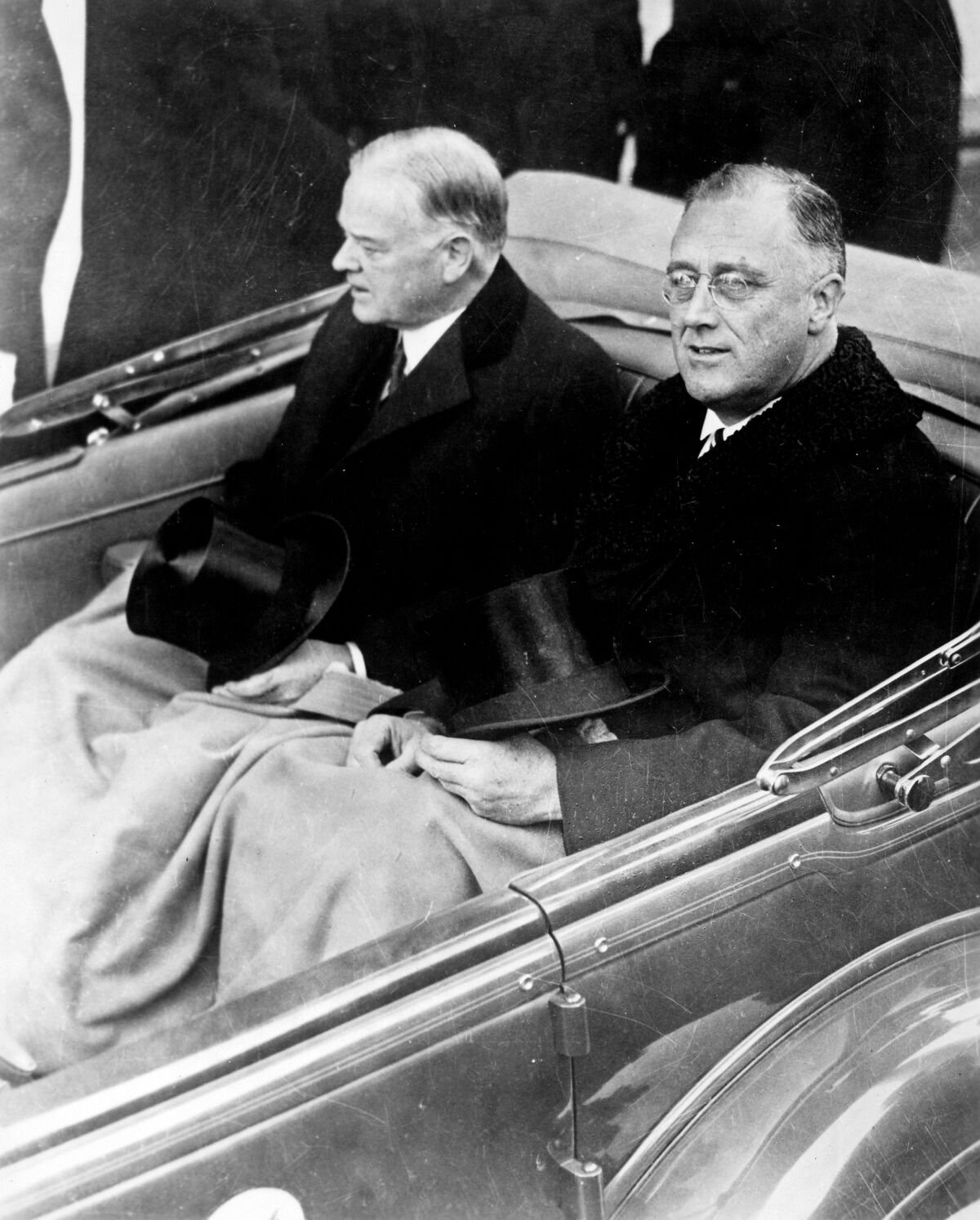 Herbert Hoover and Franklin Delano Roosevelt on their way to the U.S. Capitol for Roosevelt's inauguration in 1933. 