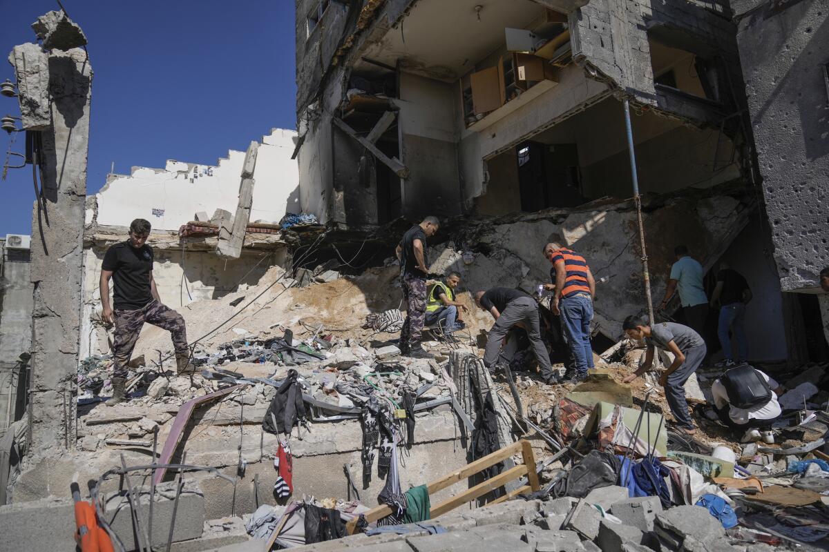 Palestinians inspect the destruction following an Israeli operation in Nur Shams refugee camp.