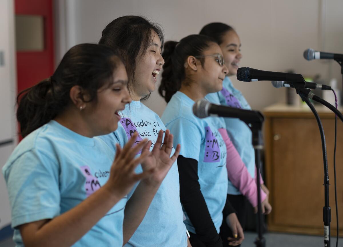 The singers of Acabella rehearse at the Academy of Music for the Blind in Whittier. From left: Riya Golakiea, 12; Dorothy Cho, 14; Brianna Vieyra, 12; and Natalie Fuentes, 12.