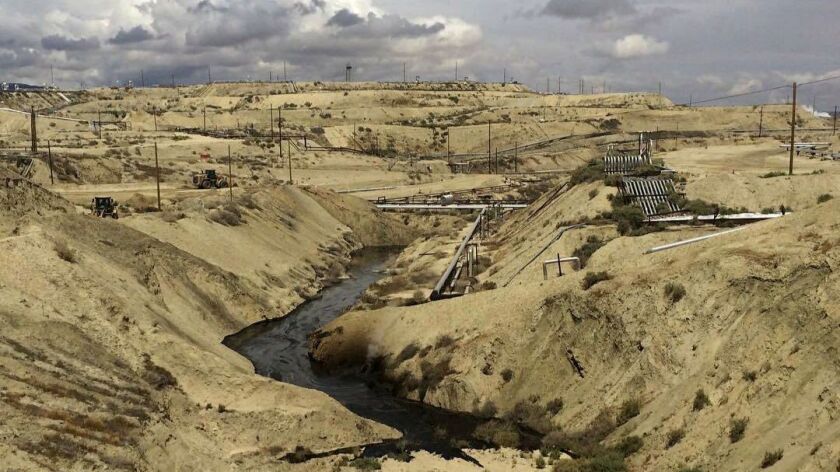 In this May 10 photo provided by the California Department of Fish and Wildlife's Office of Spill Prevention and Response, oil flows at a Chevron oil field in Kern County, Calif.