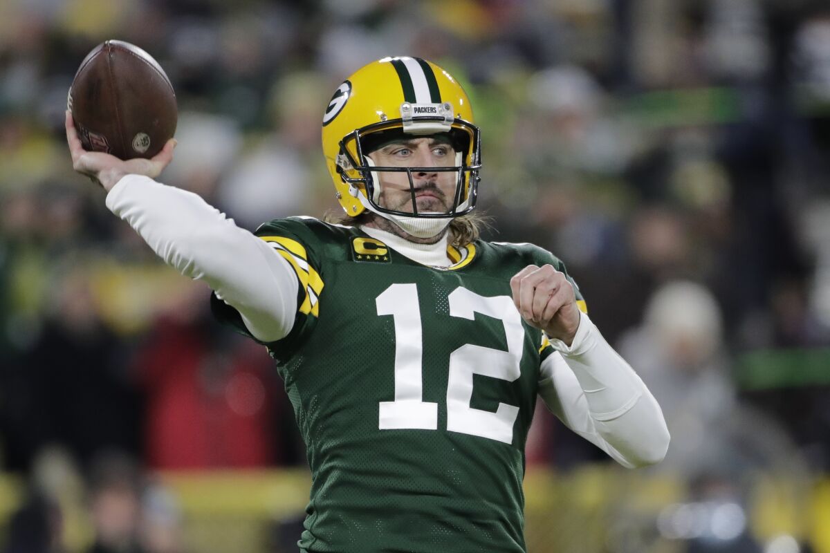 Green Bay Packers' Aaron Rodgers throws during the first half of an NFL football game against the Minnesota Vikings Sunday, Jan. 2, 2022, in Green Bay, Wis. (AP Photo/Aaron Gash)