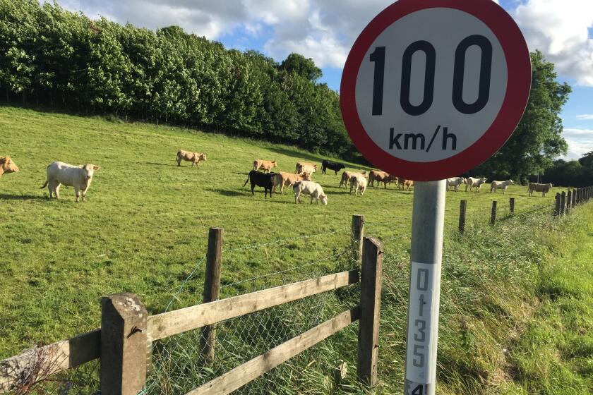 A speed limit sign in kilometers denotes the European Union side of the Ireland-Northern Ireland border.