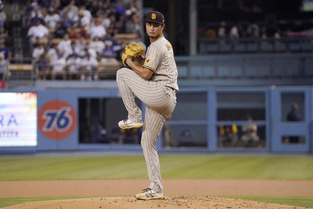 Dodgers' May saved flowing locks in high school by pitching well