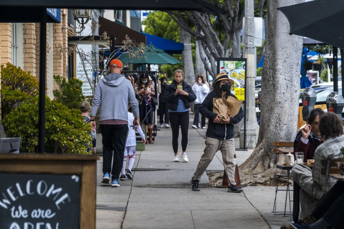 People shop in Larchmont Village.