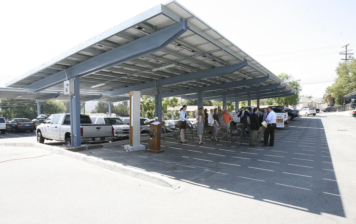 In this Sept. 2012 file photo, a covering of newly installed solar panels are showcases in the parking lot at Crescenta Valley High School in La Crescenta. The school board recently agreed to apply for clean renewable energy bonds to pay for installing panels at nine schools, only one of which — Glendale High — already has solar panels.