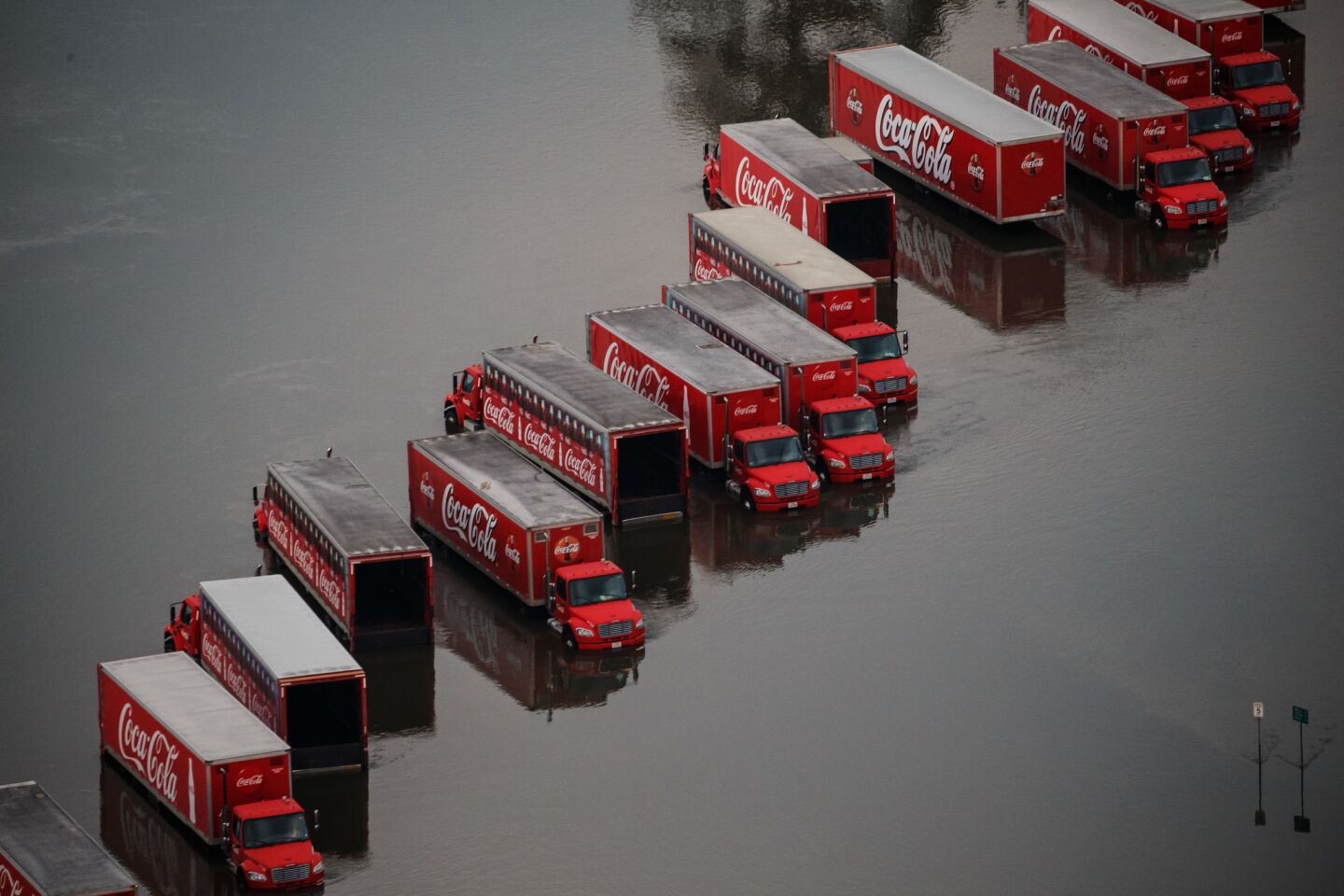 Coca-Cola delivery trucks are trapped by floodwater in Lumberton, Texas.