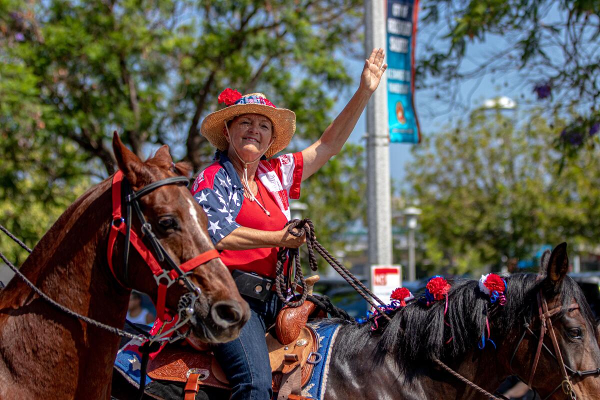 A person riding a hourse during Fourth of July in San Fernando.